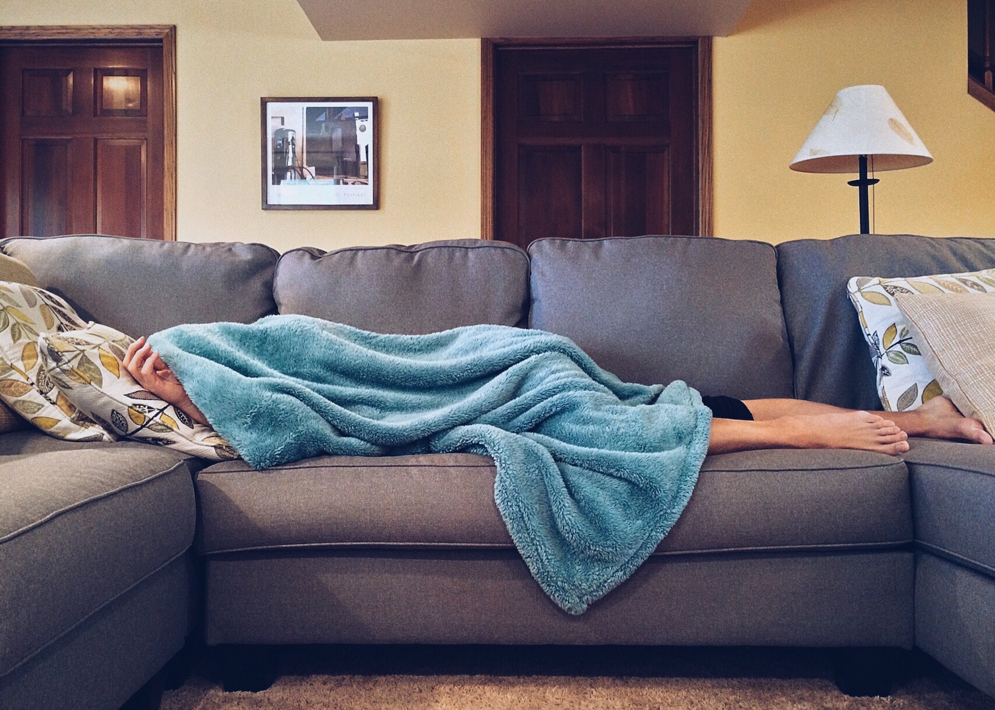 Person sleeping on sofa