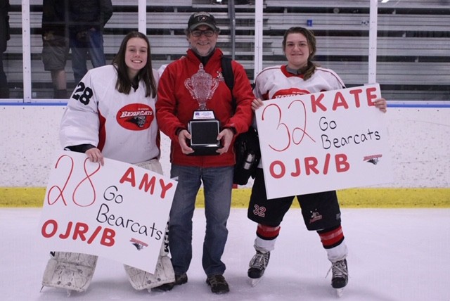 Girls with hockey trophy