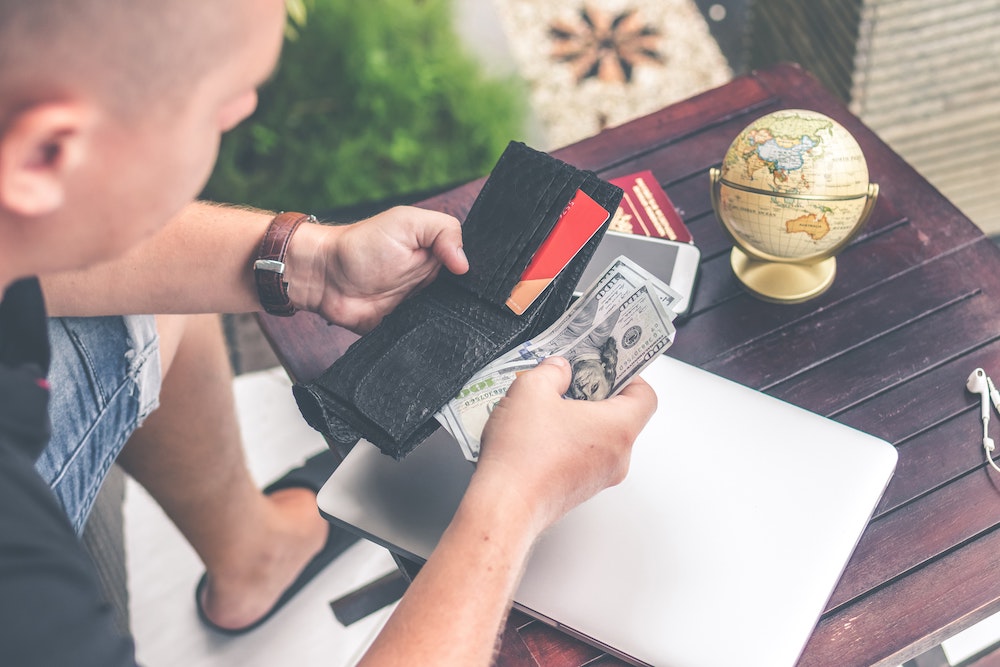 Man holding open wallet