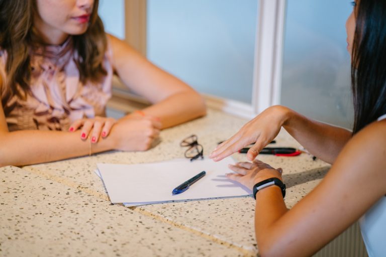 Women discussing a contract