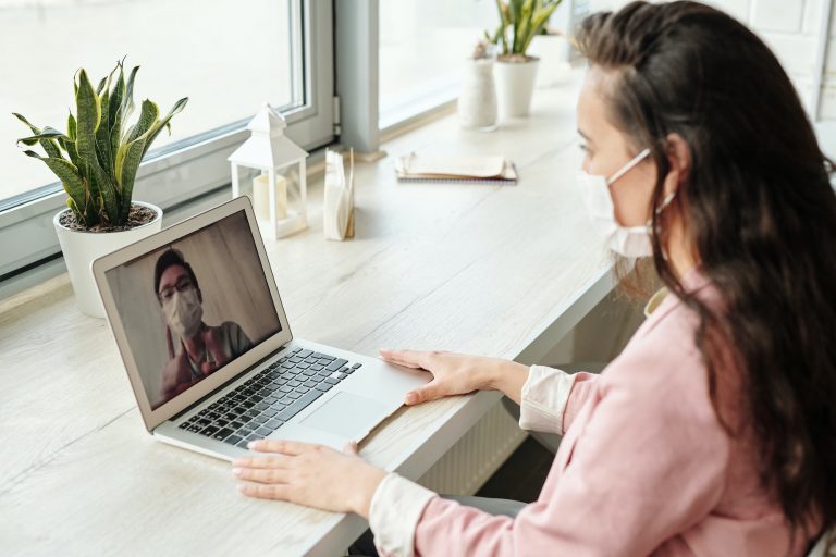 Mask wearer on laptop