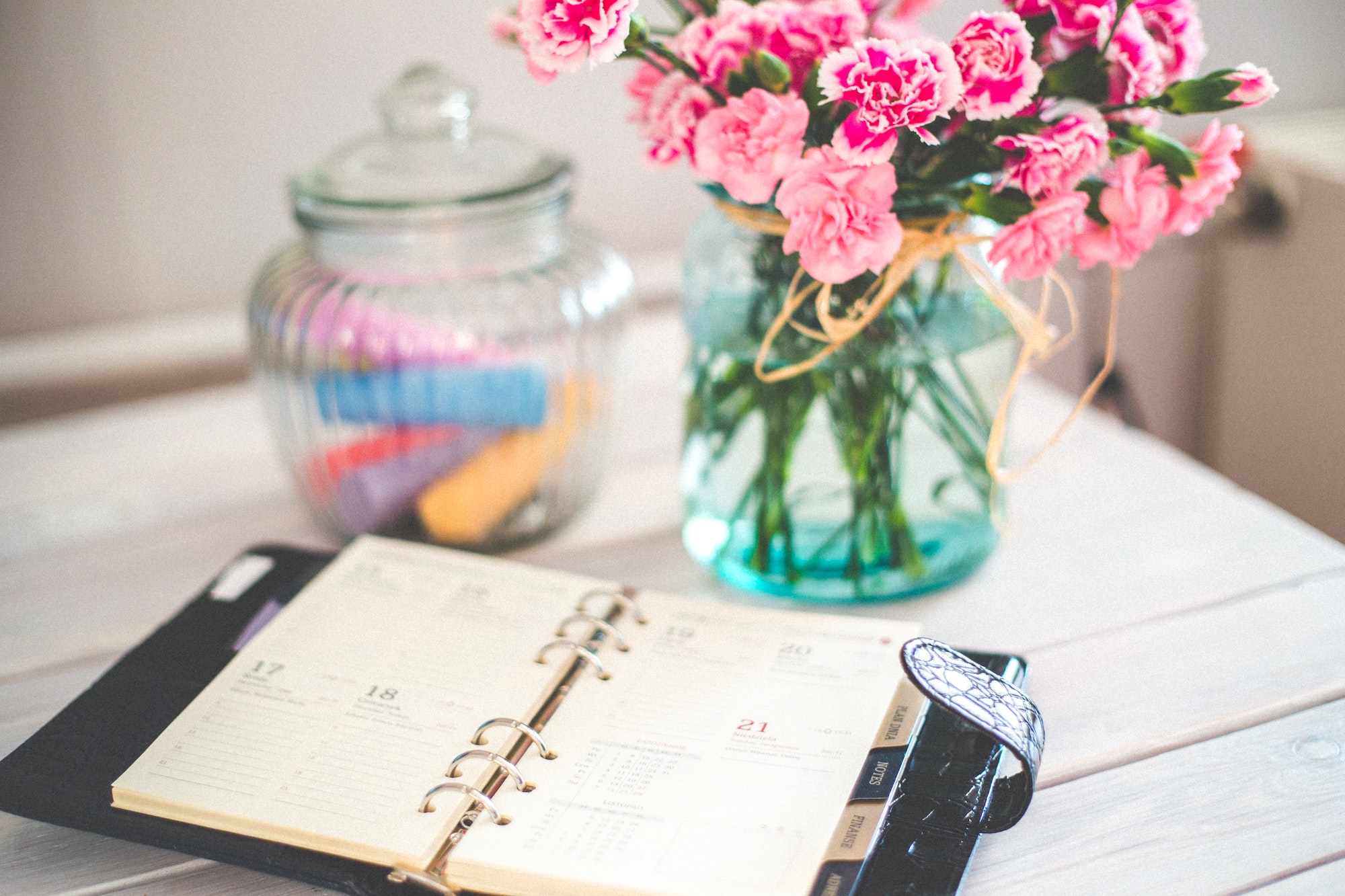 Office desk with flowers and calendar
