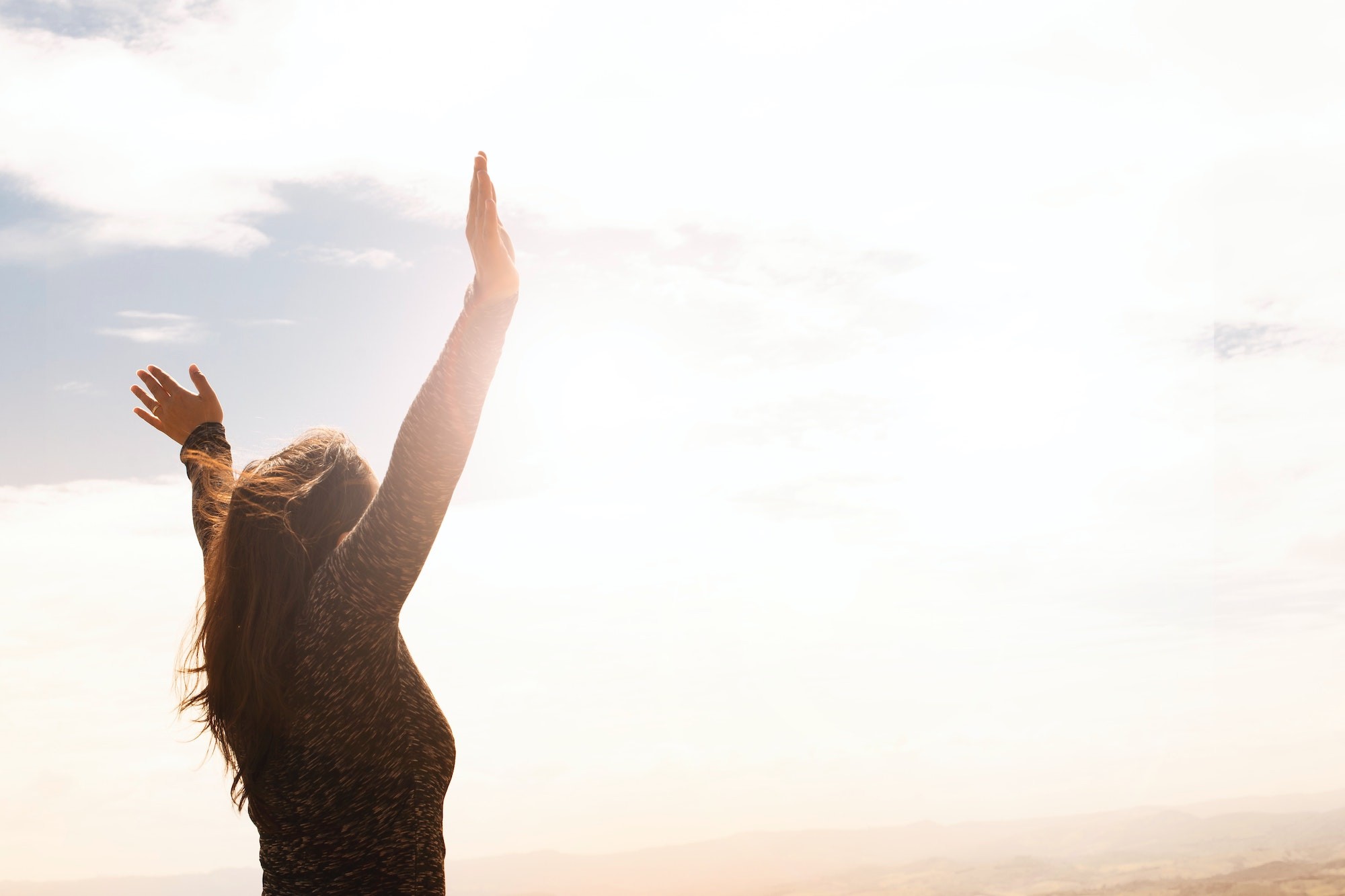 Woman raising hands