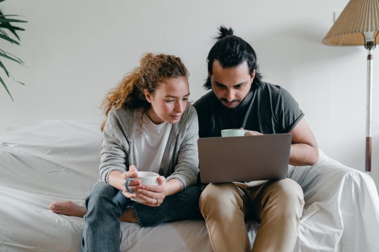 married couple with laptop
