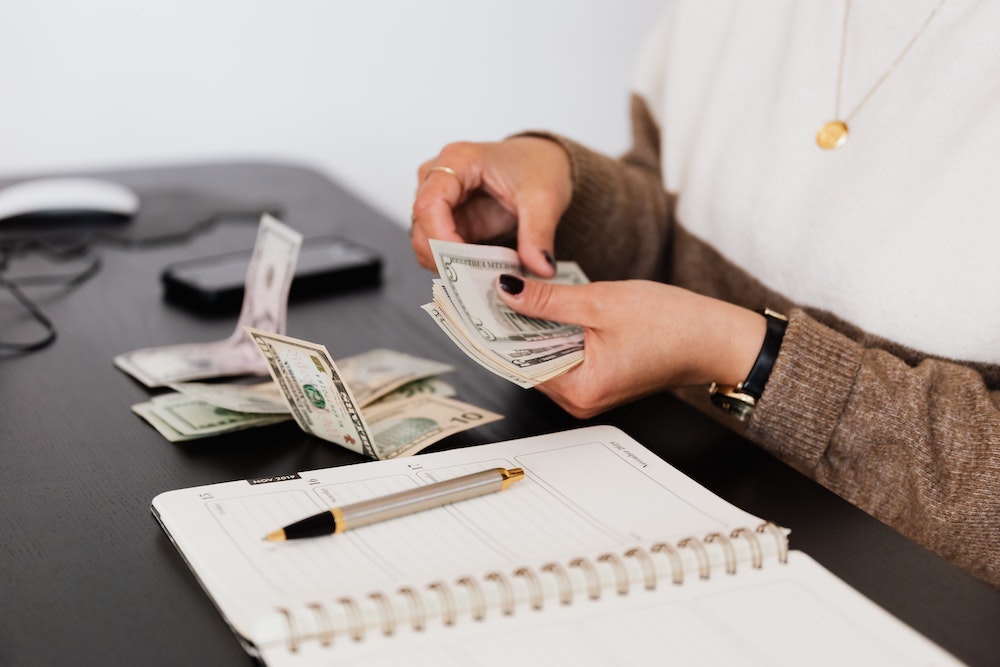 What Business Owners Need To Know About Taxes When Customers Won’t Pay | Taxgirl # counting money