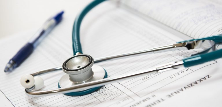 stethoscope and pen