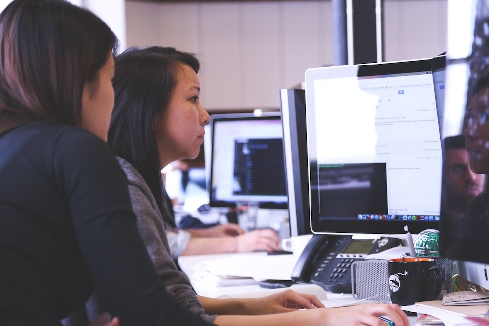Women looking at a computer