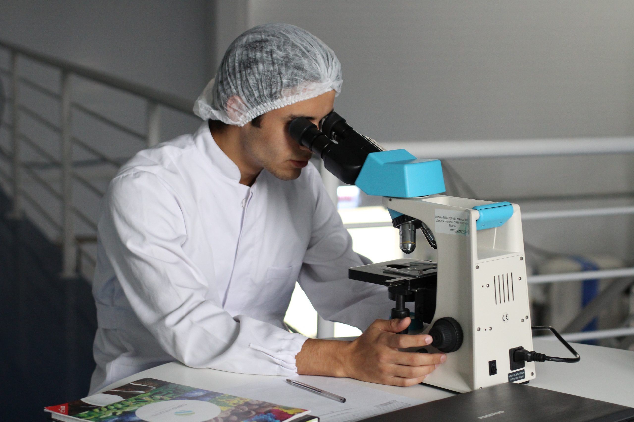 scientist with microscope