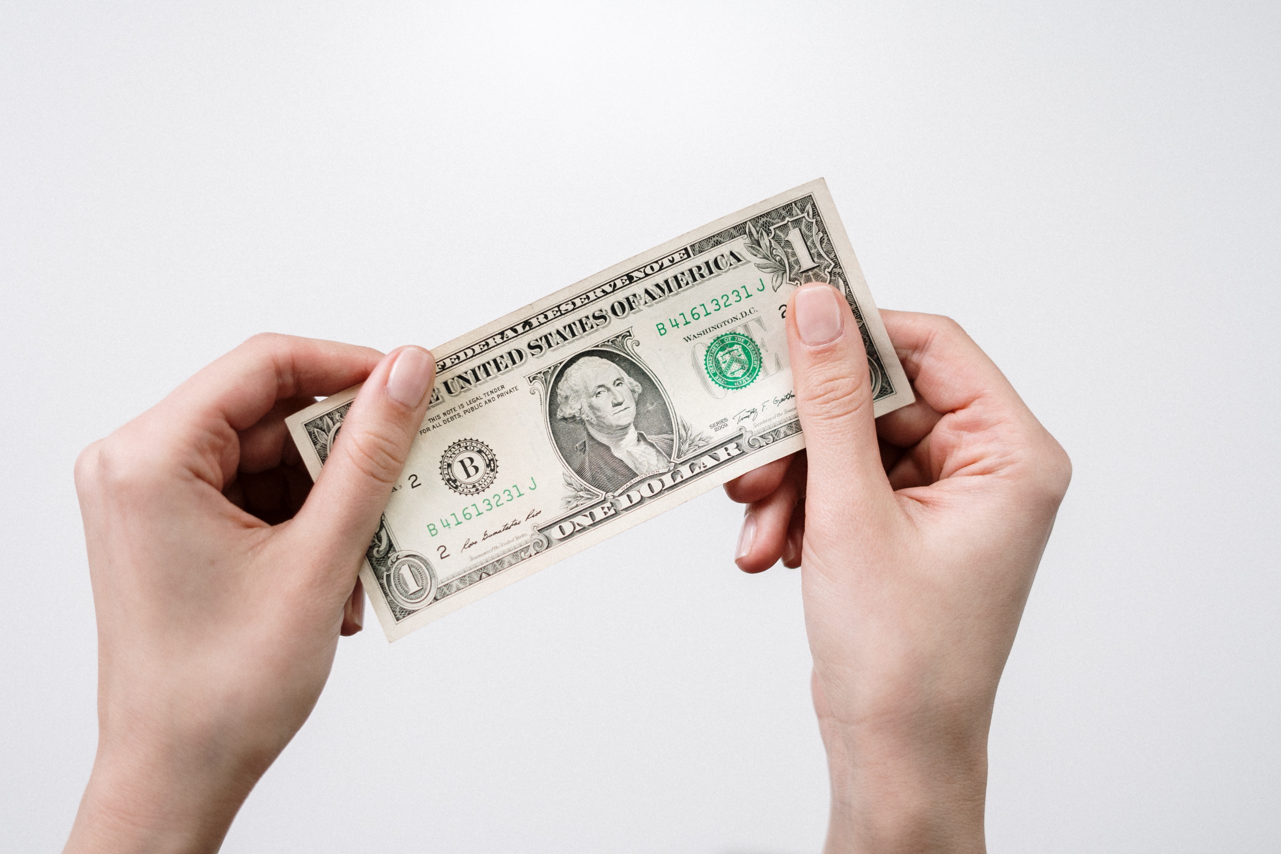 Make Your 4th Quarter Estimated Payments By January 17 | Taxgirl dollar bill in hand