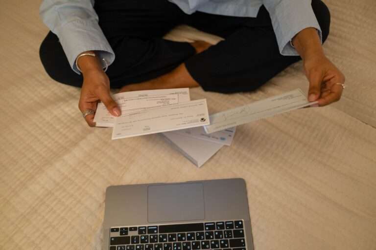 Woman looking at paychecks