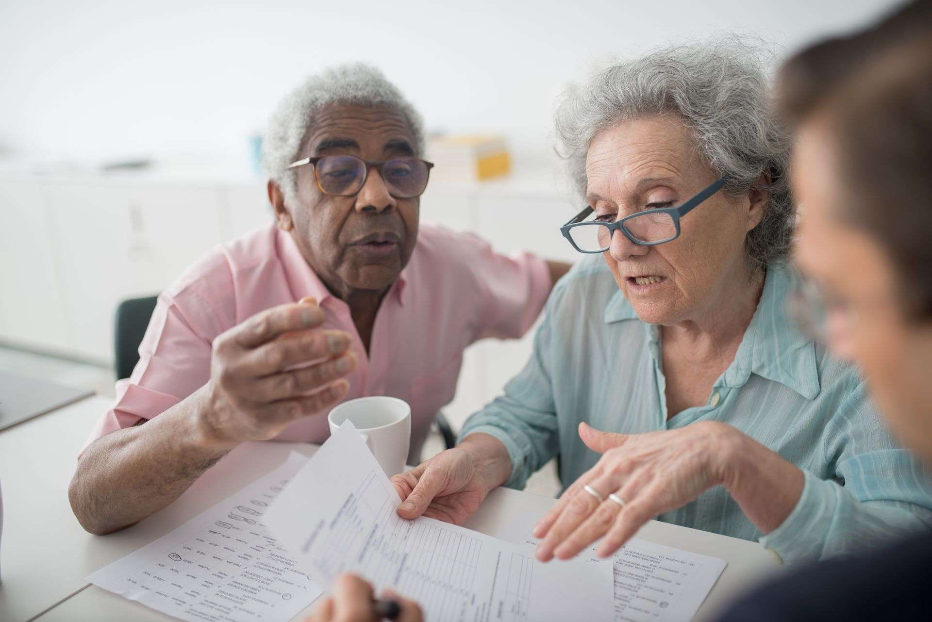 Seniors looking at a payment page