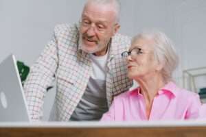 Older couple looking at a computer